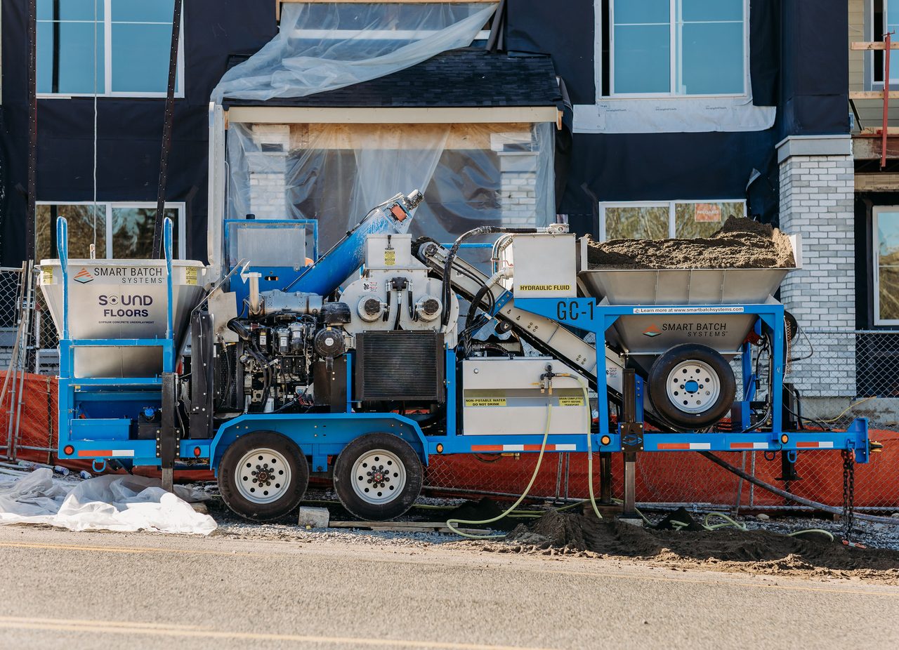 Full side profile of the Smart Batch GC-1 parked at the building