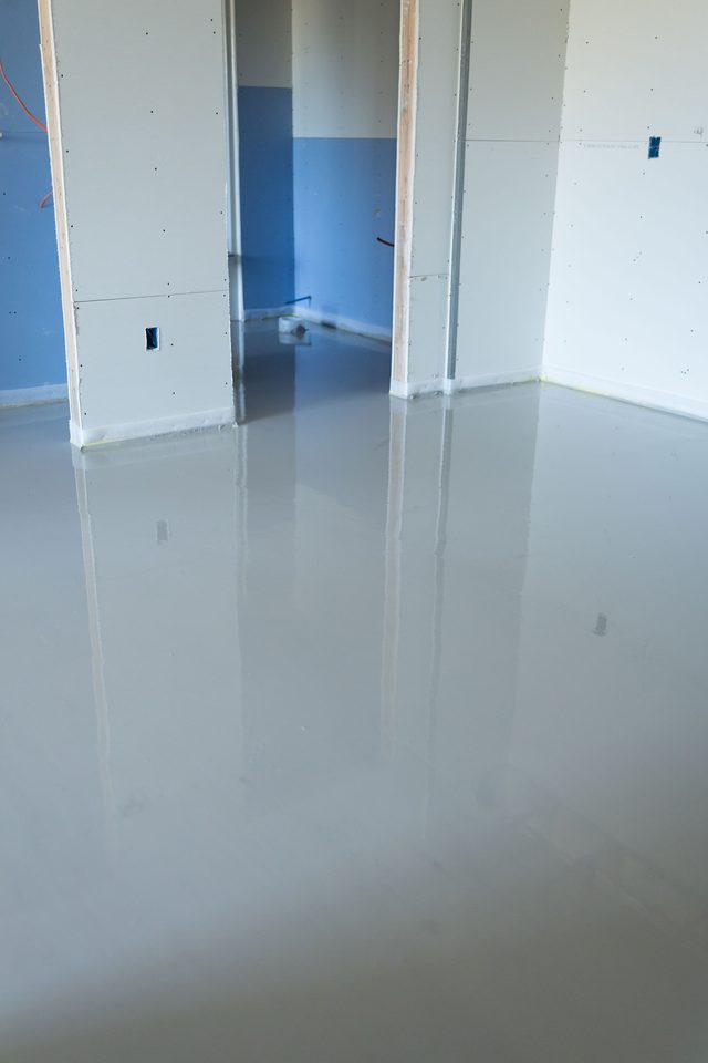 Freshly poured gypsum floor with a glossy mirror sheen